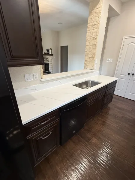 Bathroom vanity with white quartz waterfall countertop by WoodArt Cabinets San Antonio