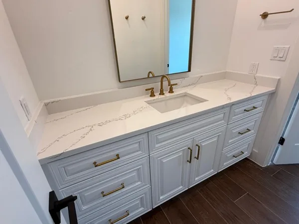luxury bathroom vanity with waterfall quartz by WoodArt Cabinets San Antonio
